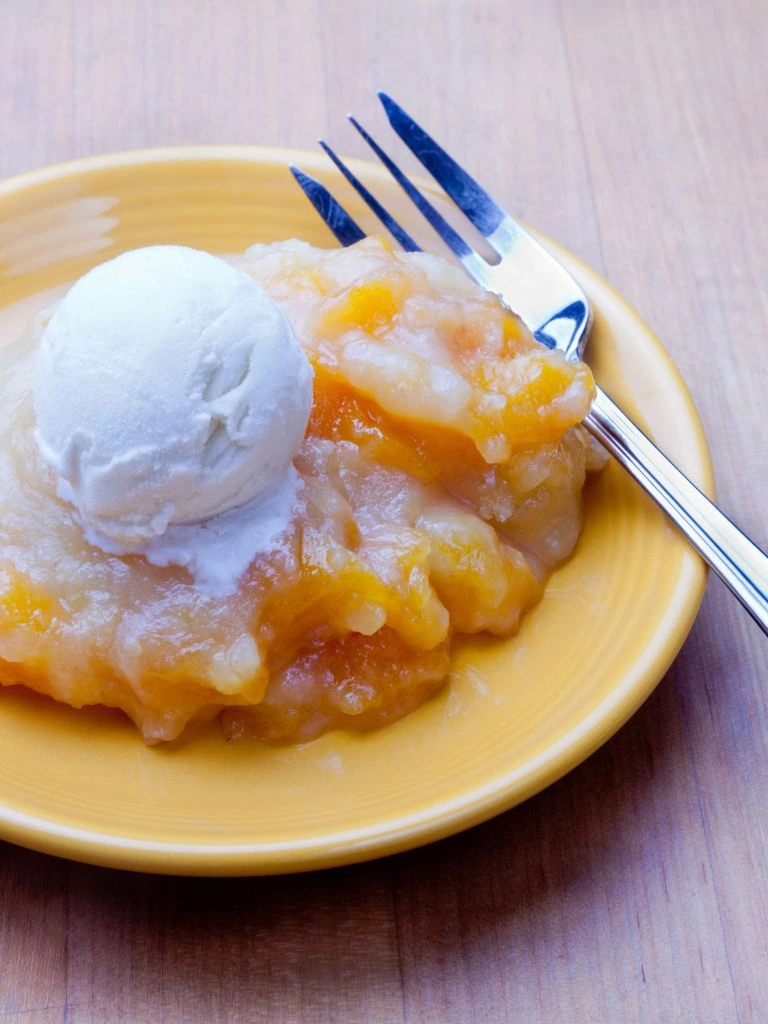 Peach cobbler with vanilla glaze