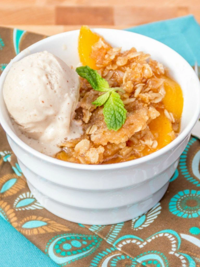 Peach cobbler with ginger snap topping